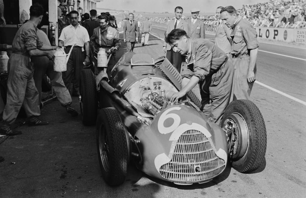 The action in the pits was oftentimes just as desirable an image as that from the track. In 1951, Mailander shows the Alfa Romeo 159, driven by Consalvo Sanesi receiving some tinkering in the pits at the French Grand Prix, Reims. 