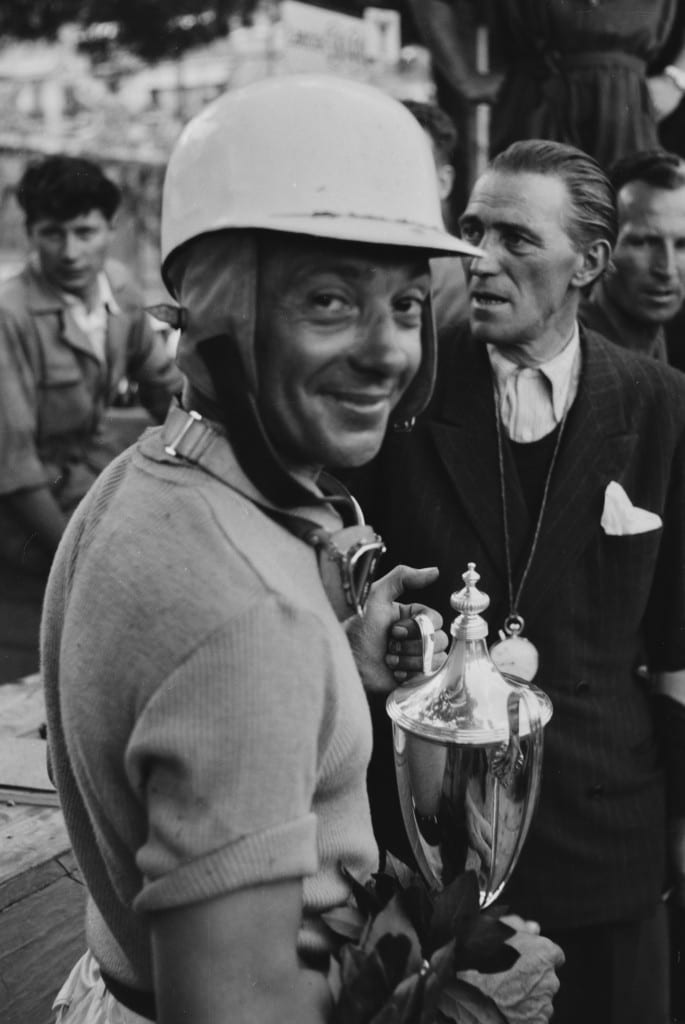 Mailander’s work is regarded for the way he captured the people in addition to the cars of his time. Robert Mazon, clutching the trophy, appears to smile here specifically for Mailander’s lens at the 1952 Monaco Grand Prix. 