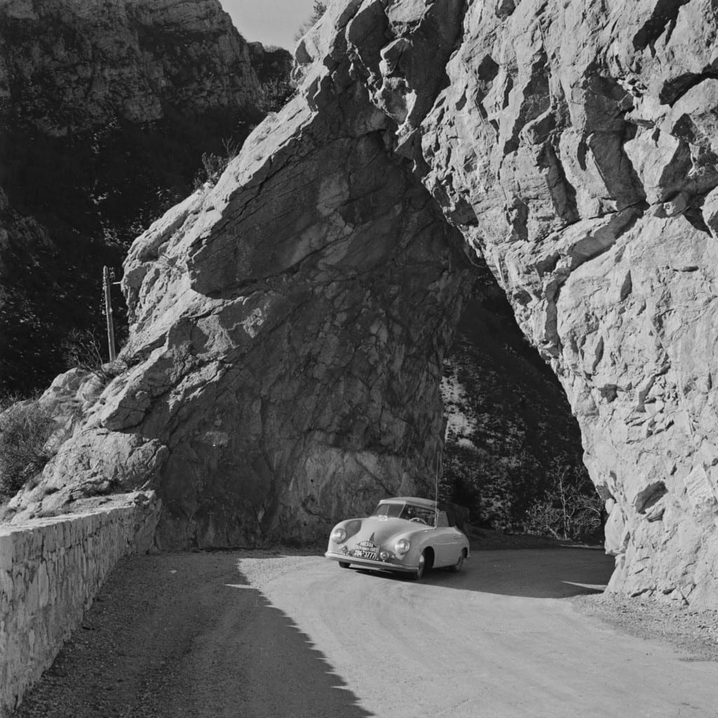 Brilliant use of natural geographic settings characterizes much of Mailander’s work, as is the case with this wonderful image of the 1954 Porsche 356 Press Car emerging from a rocky tunnel in Monte Carlo. 
