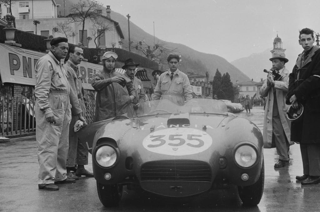 Alberto Ascari prepares for a demonstration run in a Lancia sports racer at the 1954 Racing Driver’s Course, Campione, Switzerland. 