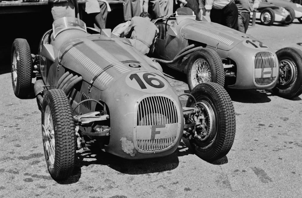 Mailander’s lens zooms in on the unique HWM-Alta, car number 16, shown here in the pits at the June 4, 1950 Swiss Grand Prix Formula Two race held in Bremgarten. Driven and constructed by George Abecassis, originally for the Formula Two class, the HWM later became eligible to compete in Grand Prix events. 